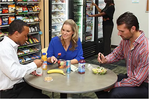 People enjoying snacks in breakroom